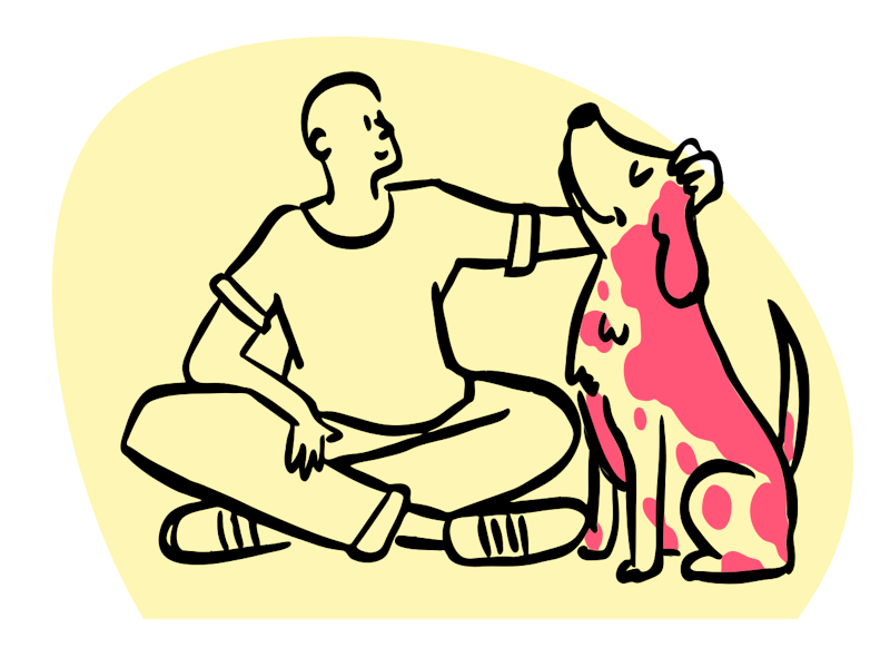 A person sitting with a dog